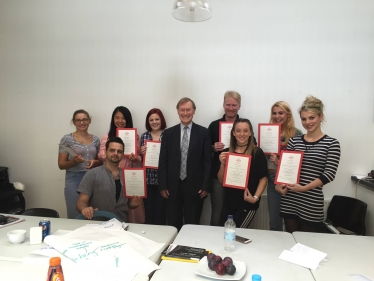 Young entrepreneurs recieve certificates from Sir David